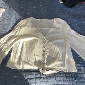 White blouse, SIZE large, bell sleeves, button detail leaving to tie in front.